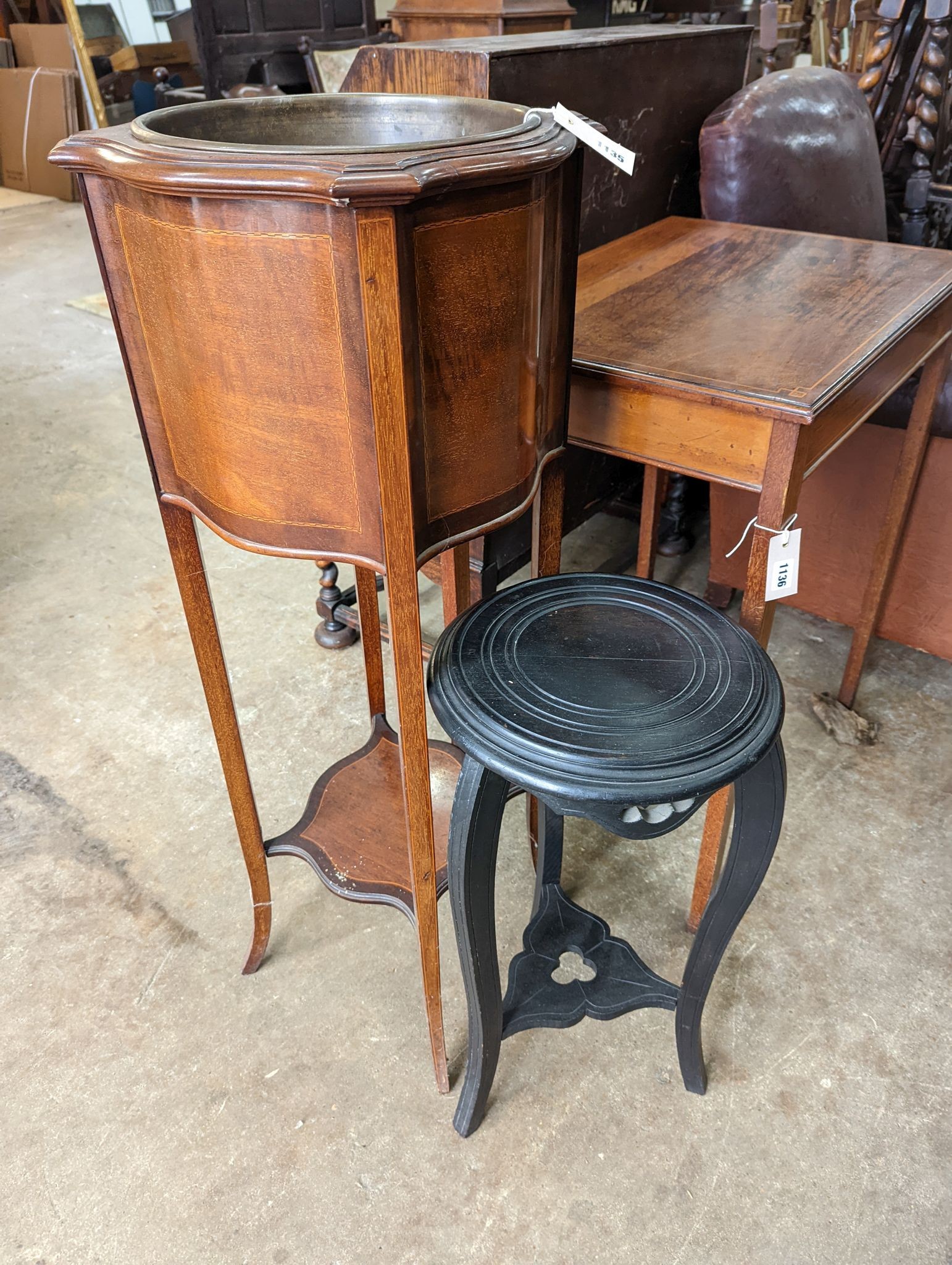 An Edwardian inlaid mahogany jardiniere with brass liner, height 99cm together with a small ebonised plant stand